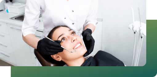 A patient undergoes tooth abscess treatment from a dentist, receiving pain relief and better oral health in general dentistry.