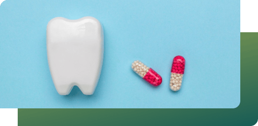A tooth with capsules symbolizes topical antibiotics used in gum disease treatment for infected gum pockets.