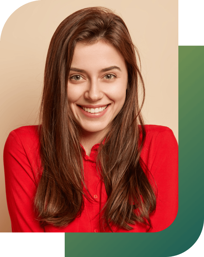A smiling girl showing off her white, healthy teeth.