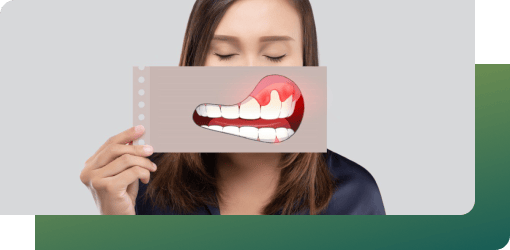 Woman displaying a dental model with an abscessed tooth, illustrating tooth abscess treatment procedures.