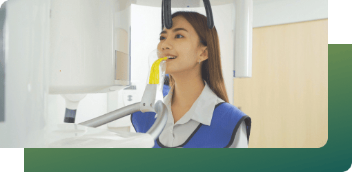 Woman undergoing advanced dental imaging for accurate diagnosis, essential for emergency dental care.