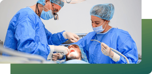 Dentists performing advanced deep cleaning with flap surgery as part of gum infection treatment for severe gum disease.