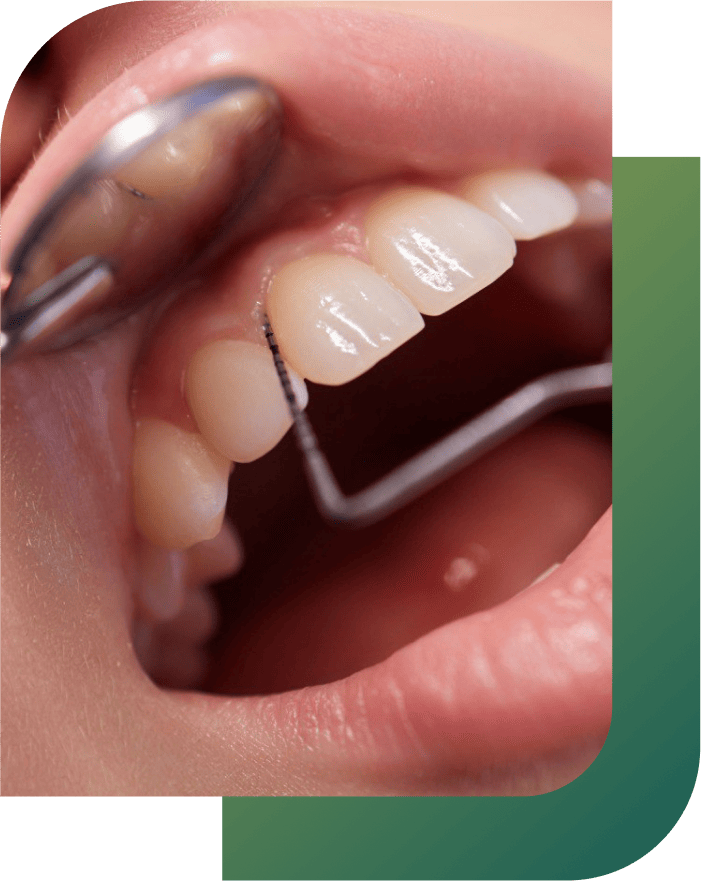 A patient receiving gum treatment in a dental clinic in Woden, Canberra.