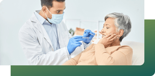A senior patient being assessed by a dentist.