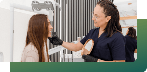 A dentist performing an assessment for a patient’s dentures.