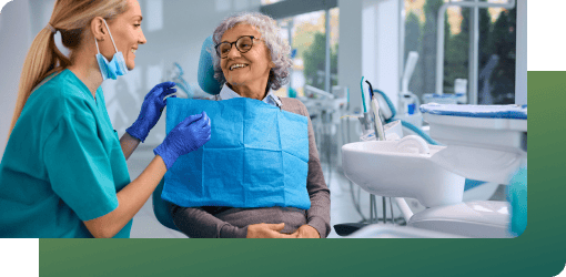 Elderly patient consulting a caring dentist.