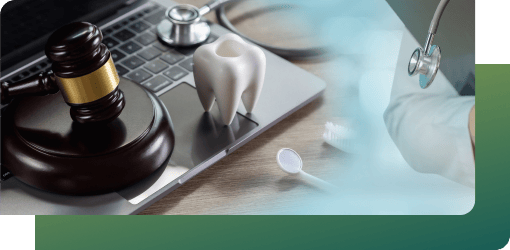 A stethoscope, gavel, and tooth on a laptop symbolize adherence to ACT Health and ADA dental infection control guidelines.