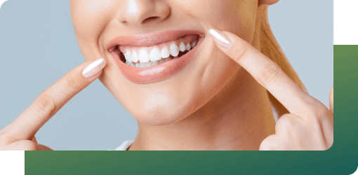 A young girl smiling brightly, showing her healthy white teeth, enhanced by teeth whitening.
