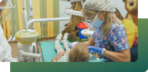A dentist carefully operating on a child's teeth in a clinic, using advanced tools and pediatric orthodontics for comfort.