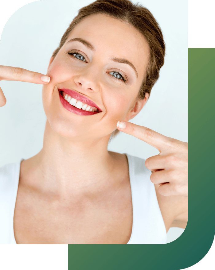 Girl smiling confidently, showing her teeth with a bright, self-assured expression.
